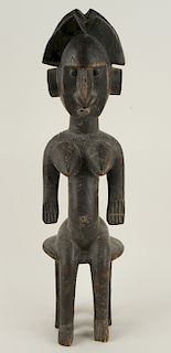 AN AFRICAN CARVED WOOD FEMALE FIGURE