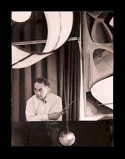 Man Ray (Emmanuel Radinski),  American 1890-1976,"Man Ray In His Workshop", rare proof photo from the U.S.I.S. archives, 