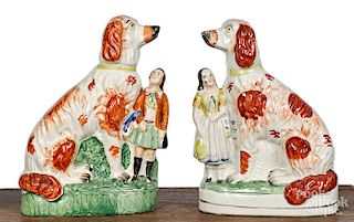 Pair of Staffordshire spaniel and child groups