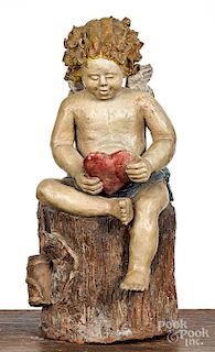 Painted redware figure of cupid