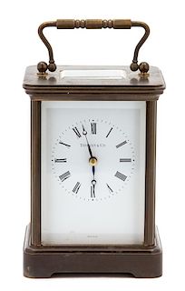 An American Brass Carriage Clock Height 5 1/2 x width 4 x depth 3 1/2 inches.