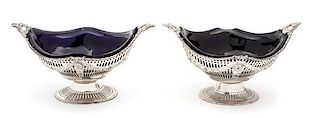 A Pair of English Sviler Oval Footed Baskets, Charles Stuart Harris, London, 1896, of boat form with reticulated decoration over