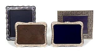Four Sterling Silver Framed Easel Back Picture Frames Largest, height 13 x width 10 3/4 inches.