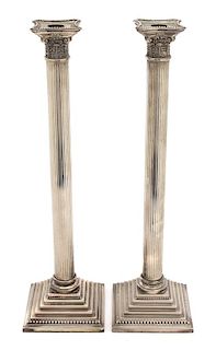 A Pair of Silver Plate Tall Columnar Candlesticks Height 18 1/8 x sqauered diameter 5 inches.