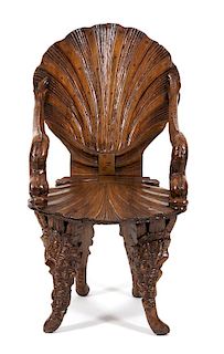 A Venetian Carved Walnut Grotto Armchair Height 33 1/4 inches.