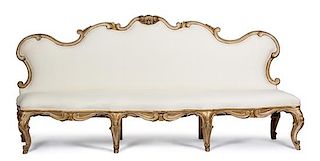 A Venetian Style Carved Giltwood Banquette Height 46 x width 100 x depth 24 1/2 inches.