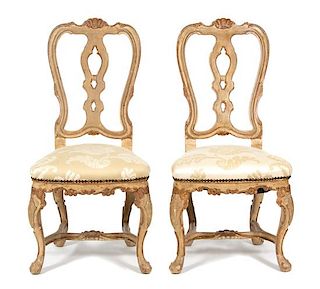 A Set of Twelve Italian Rococo Style Painted Dining Chairs Height 42 1/2 inches.