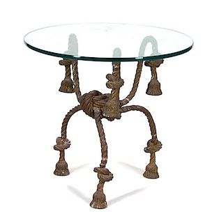 An Italian Gilt Metal Rope and Tassle Glass Top Table Height 29 1/2 x diameter 32 1/2 inches.