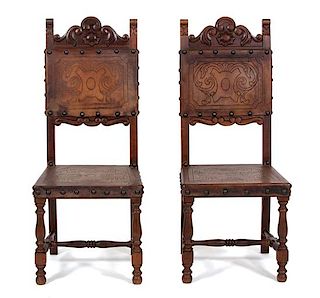 A Set of Six Spanish Colonial Style Carved Mahogany and Leather Side Chairs Height 43 1/2 inches.