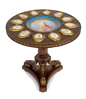 A Sevres Style Porcelain and Gilt Bronze Mounted Mahogany Gueridon Height 30 x diameter 29 inches.