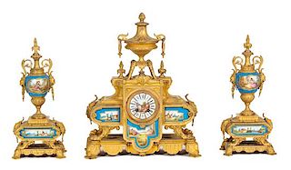 A Sevres Style Porcelain Mounted Gilt Bronze Three-Piece Clock Garniture Height of clock 19 inches.