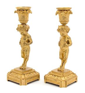 A Pair of French Gilt Bronze Candlesticks Height 8 x diameter squared 3 inches.