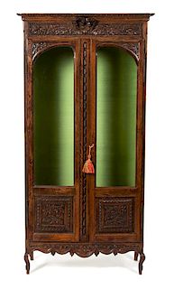 A French Provincial Style Carved Oak Display Cabinet Height 68 x width 34 1/2 x depth 13 inches.