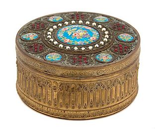 A French Gilt Bronze Jeweled and Enameled Covered Box Height 2 x diameter 4 1/2 inches.