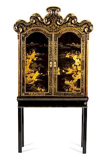 A Chinese Black and Gilt Lacquer Cabinet Height 81 3/4 x width 42 1/2 x depth 13 inches.