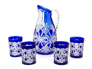 A Baccarat Cobalt Cut-to-Clear Crystal Pitcher and Ten Tumblers Height of pitcher 10 1/2 inches.