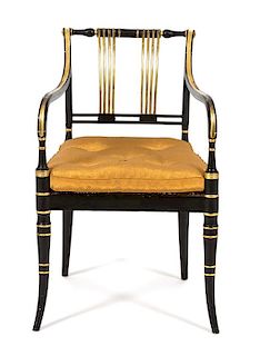 A Regency Ebonized and Gilt Decorated Open Armchair Height 32 x width 20 x depth 18 inches.