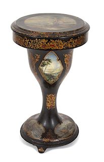 A Regency Polychrome and Gilt Decorated Papier Mache Sewing Table Height 29 1/2 x diameter 17 3/4 inches.