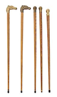 A Collection of Five Brass Handled Ash Canes Length of tallest 35 1/2 inches.