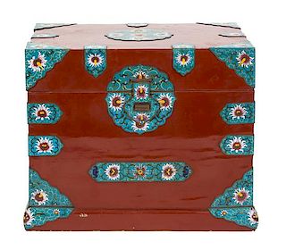 A Chinese Red Lacquer Bride's Box with Champleve Enamel Mounts Height 21 x width 25 1/2 x depth 18 1/2 inches.