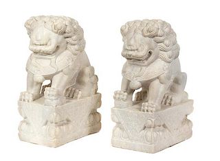 A Pair of Chinese Carved White Marble Foo Lions Height 19 1/2 inches.