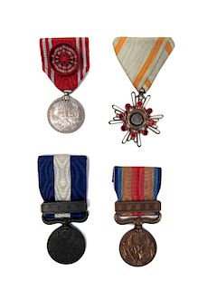 Group of 4 Japanese Merit Medals.