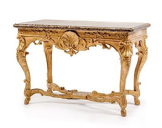 A Regence Carved Giltwood Console Table Height 31 1/2 x width 46 x depth 25 1/2 inches.