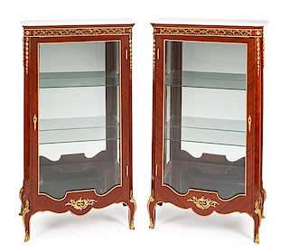 A Pair of Louis XV Style Vitrine Cabinets Height 59 3/4 x width 34 x depth 18 inches.