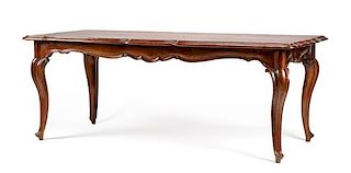 A Louis XV Style Carved Mahogany Dining Table Height 31 1/4 x width 82 x depth 36 3/4 inches.
