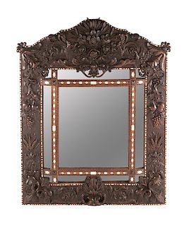 A French Carved and Inlaid Mirror Height 65 x width 53 inches.