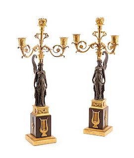 A Pair of Empire Gilt and Patinated Bronze Three-Light Candelabra Height 19 5/8 inches.