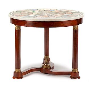 An Empire Style Gilt Bronze Mounted Mahogany and Specimen Marble Center Table Height 29 x diameter of top 34 inches.
