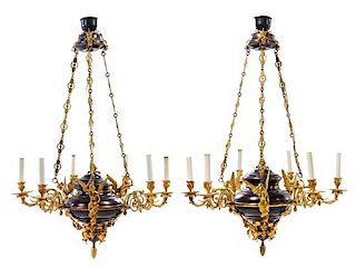 A Pair of Empire Style Gilt and Patinated Bronze Six-Light Chandeliers Height 40 x diameter 25 inches.