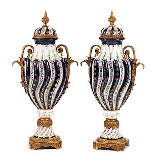 A Pair of Sevres Style Bronze Mounted Porcelain Urns Height 29 inches.