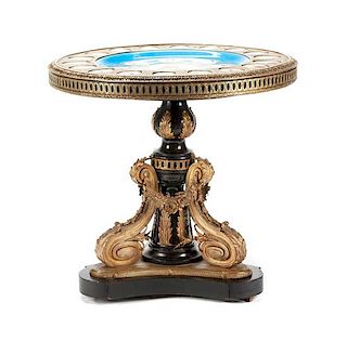 A Napoleon III Porcelain Mounted Gilt Bronze Gueridon Height 30 1/2 x diameter of top 31 3/4 inches.