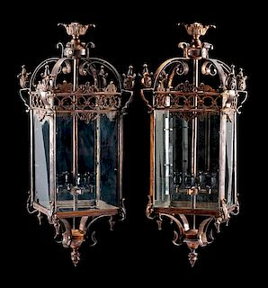 A Pair of Continental Patinated Metal Lanterns Height 18 inches.