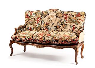 An Italian Painted and Parcel Gilt Settee Height 43 x width 61 x depth 32 inches.