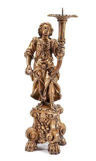 An Italian Carved Giltwood Figural Torchere Height 47 1/4 inches.