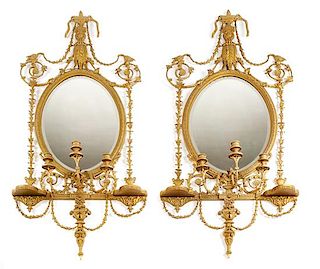A Pair of Continental Giltwood Girandole Mirrors Height 59 x width 30 inches.