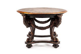 A Continental Carved and Painted Center Table Height 30 x diameter of top 42 1/2 inches.