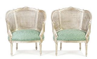 A Pair of Louis XVI Style Silvered Caned Bergeres, Height 33 7/8 inches.