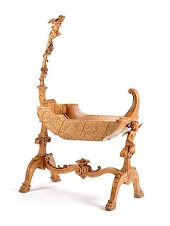 An Italian Carved Cradle Height 66 1/2 x length 41 x depth 18 1/4 inches.
