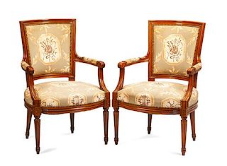 A Pair of Neoclassical Walnut Armchairs Height 34 inches.