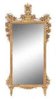 An Italian Giltwood Mirror Height 56 x width 27 1/2 inches.