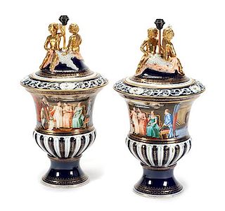 A Pair of Continental Porcelain Covered Urns Height overall 35 inches.