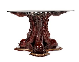 A Continental Carved and Parcel Gilt Center Table Height 29 1/4 x diameter of top 48 inches.