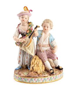A Meissen Porcelain Figural Group Height 6 1/8 inches.