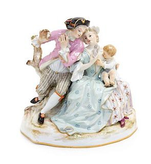 * A Meissen Porcelain Figural Group Height 5 3/4 inches.