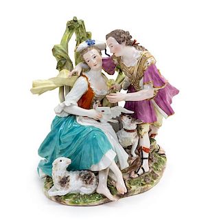 * A Meissen Porcelain Figural Group Height 7 inches.