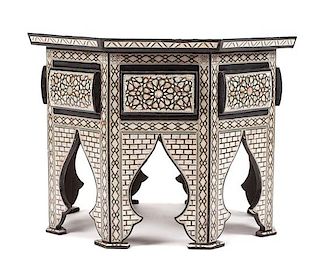 A Moorish Style Mother-of-Pearl Inlaid Table Height 22 1/2 x diameter of top 31 1/2 inches.